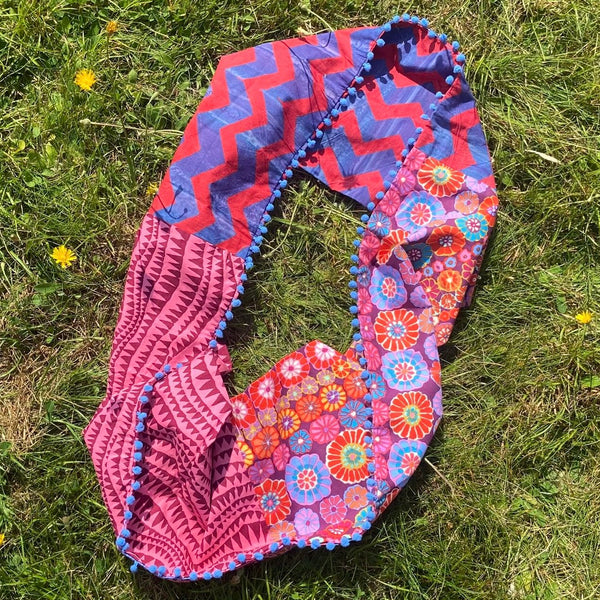 SAMPLE SALE: 26AR: Kaffe Fassett Collective Infinity Scarf with Blue Pompom Trim (Red/Blue/Purple)