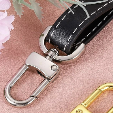 HARDWARE: FOUR ¾" / 19mm Swivel Snap Hooks with D Ring Attachment Points: Light Gold colour