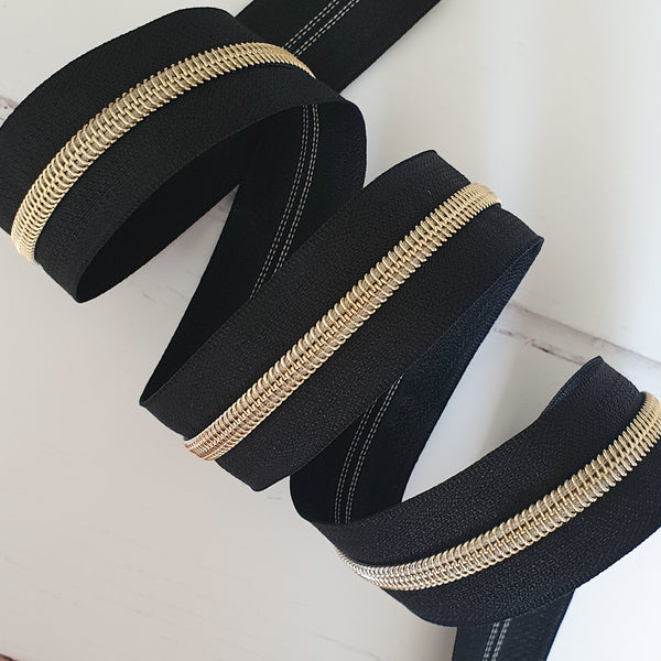 Zipper Tape BY THE METRE: Black with Gold Coil Teeth